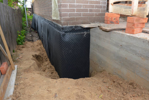 Happy homeowners after waterproofing job in Rocky Ridge